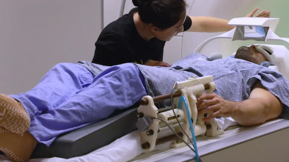 Functional MRI in Conjunction with a Novel MRI-compatible Hand-induced Robotic Device to Evaluate Rehabilitation of Individuals Recovering from Hand Grip Deficits